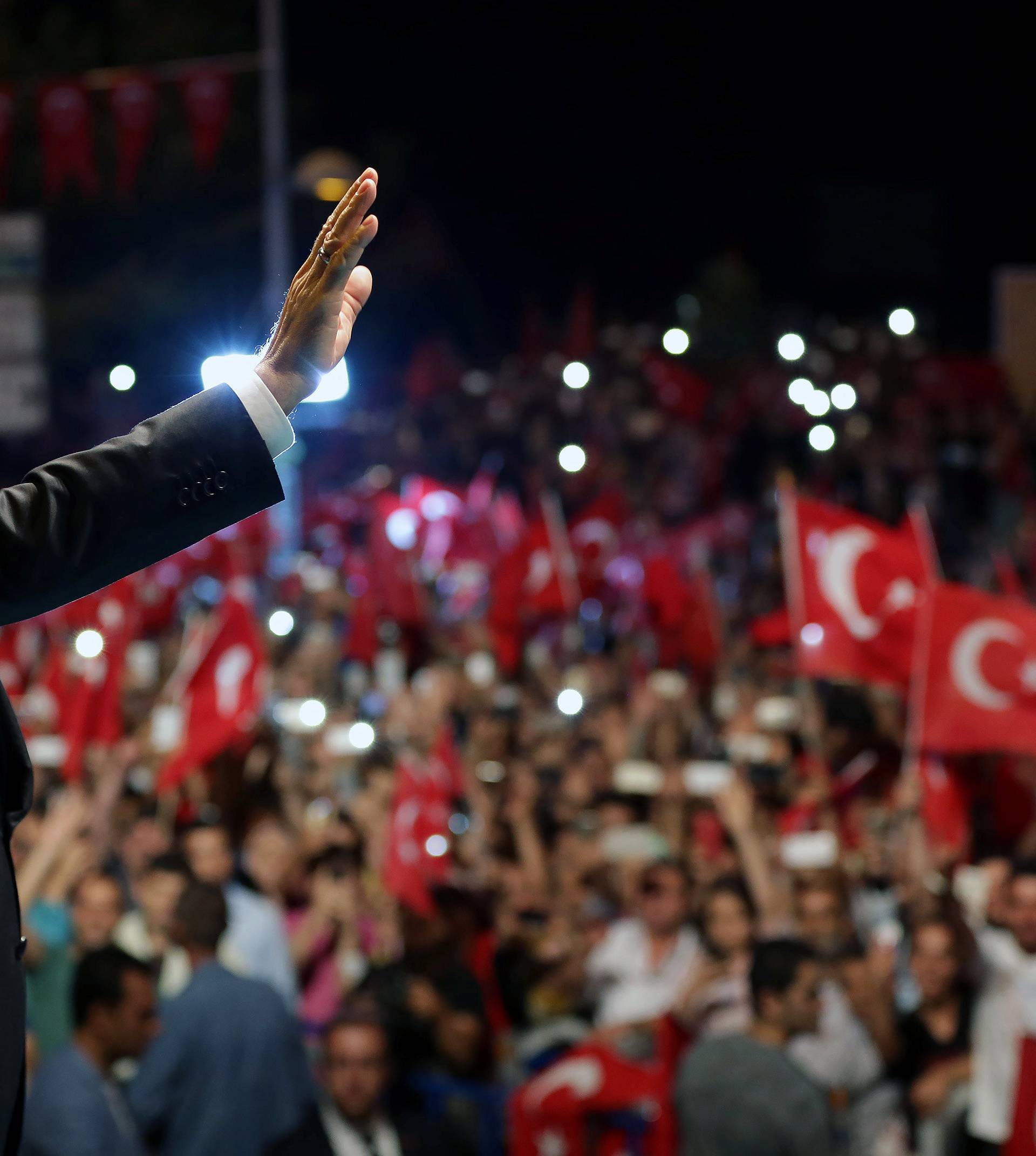 Handout photo of Turkish President Erdogan greeting his supporters outside of his residence in Istanbul