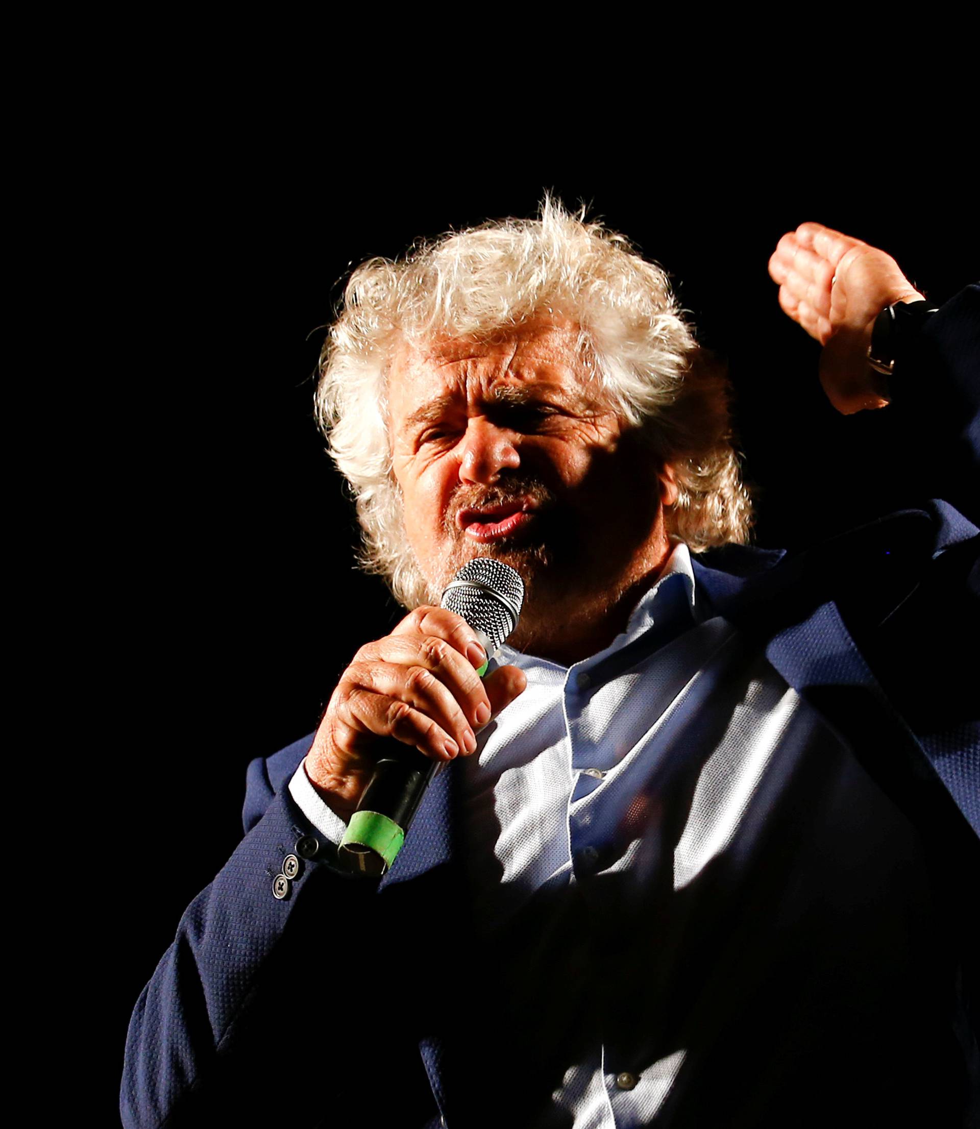 Beppe Grillo, the founder of the anti-establishment 5-Star Movement, talks during a march in support of the 'No' vote in the upcoming constitutional reform referendum in Rome