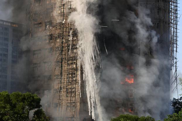 Flames engulf bamboo scaffolding across multiple buildings at Wang Fuk Court housing estate, in Tai Po
