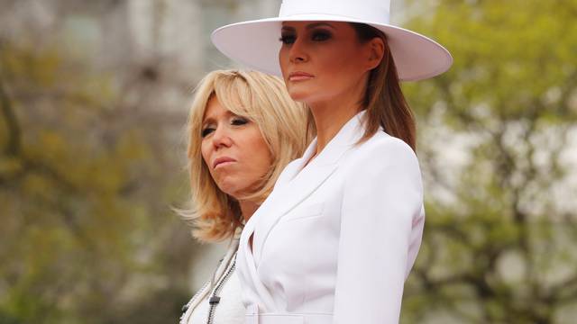 U.S. President Donald Trump and first lady Melania Trump welcome French President Emmanuel Macron and his wife Brigitte Macron during an arrival ceremony at the White House in Washington