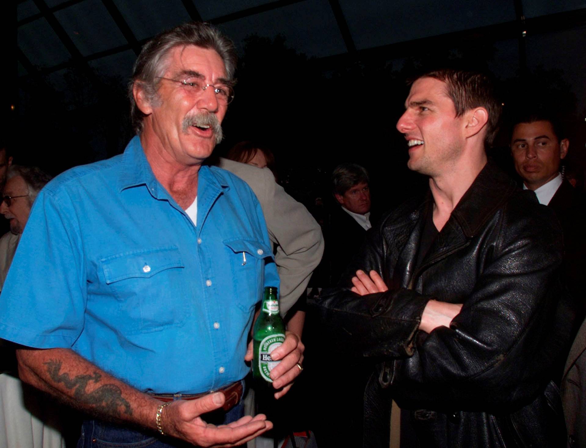 FILE PHOTO R. Lee Ermey of "Full Metal Jacket" and Tom Cruise of "Eyes Wide Shut" talk together at a reception in Los Angeles