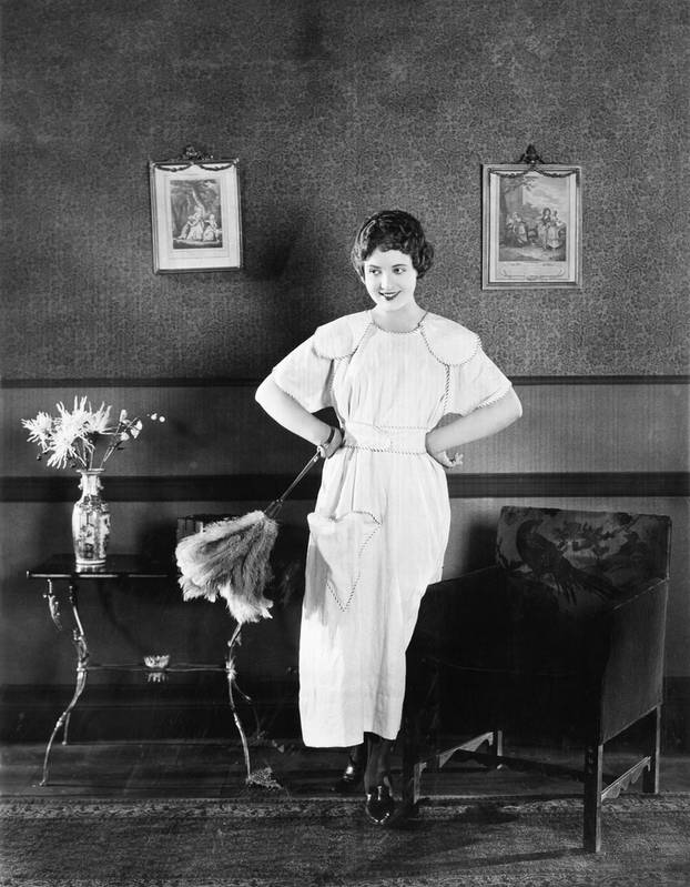 Young,Woman,In,An,Apron,And,A,Duster,Standing,In