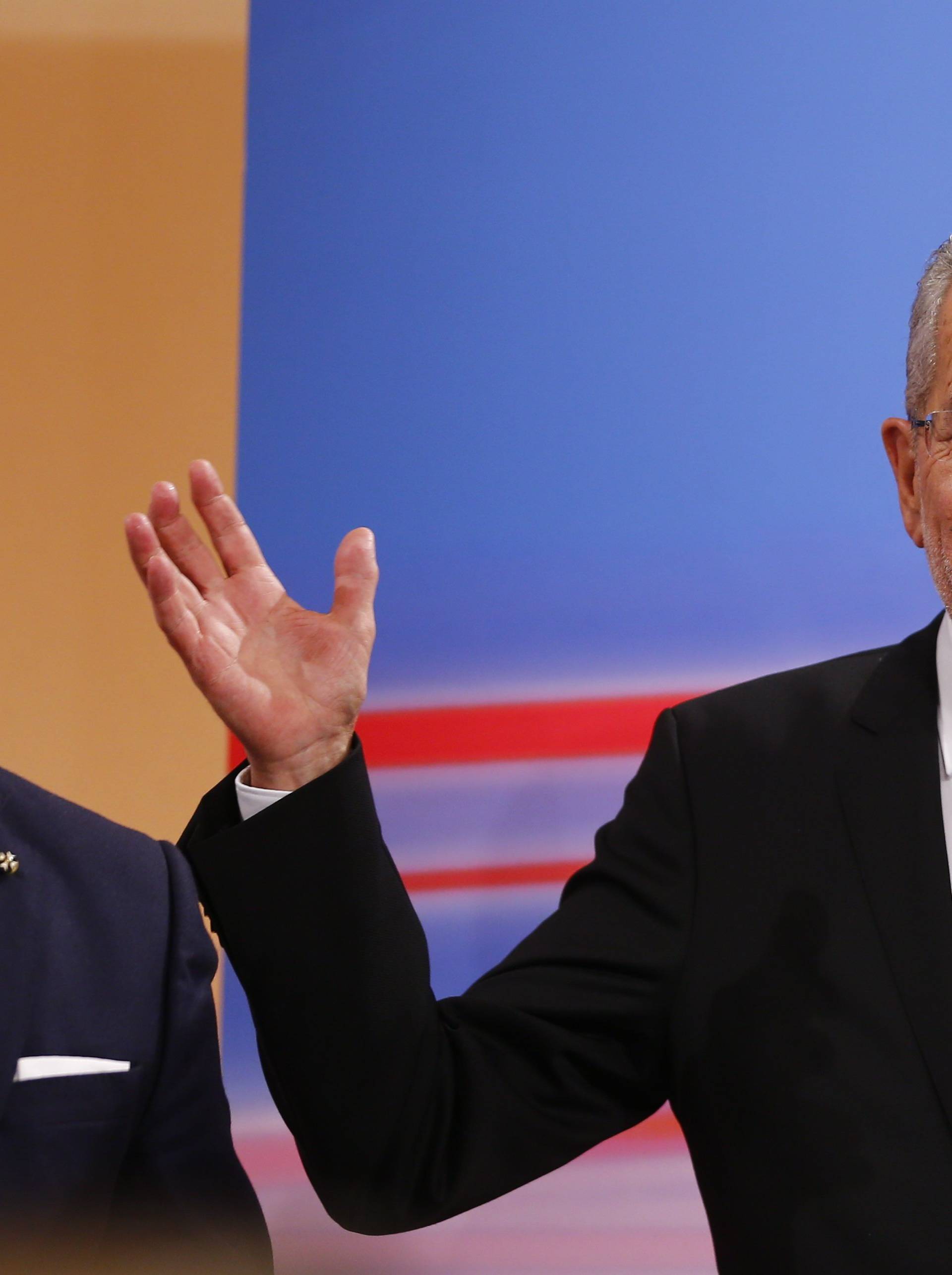 Austrian presidential candidate Van der Bellen, who is supported by the Greens, and reacts during a TV show in Vienna