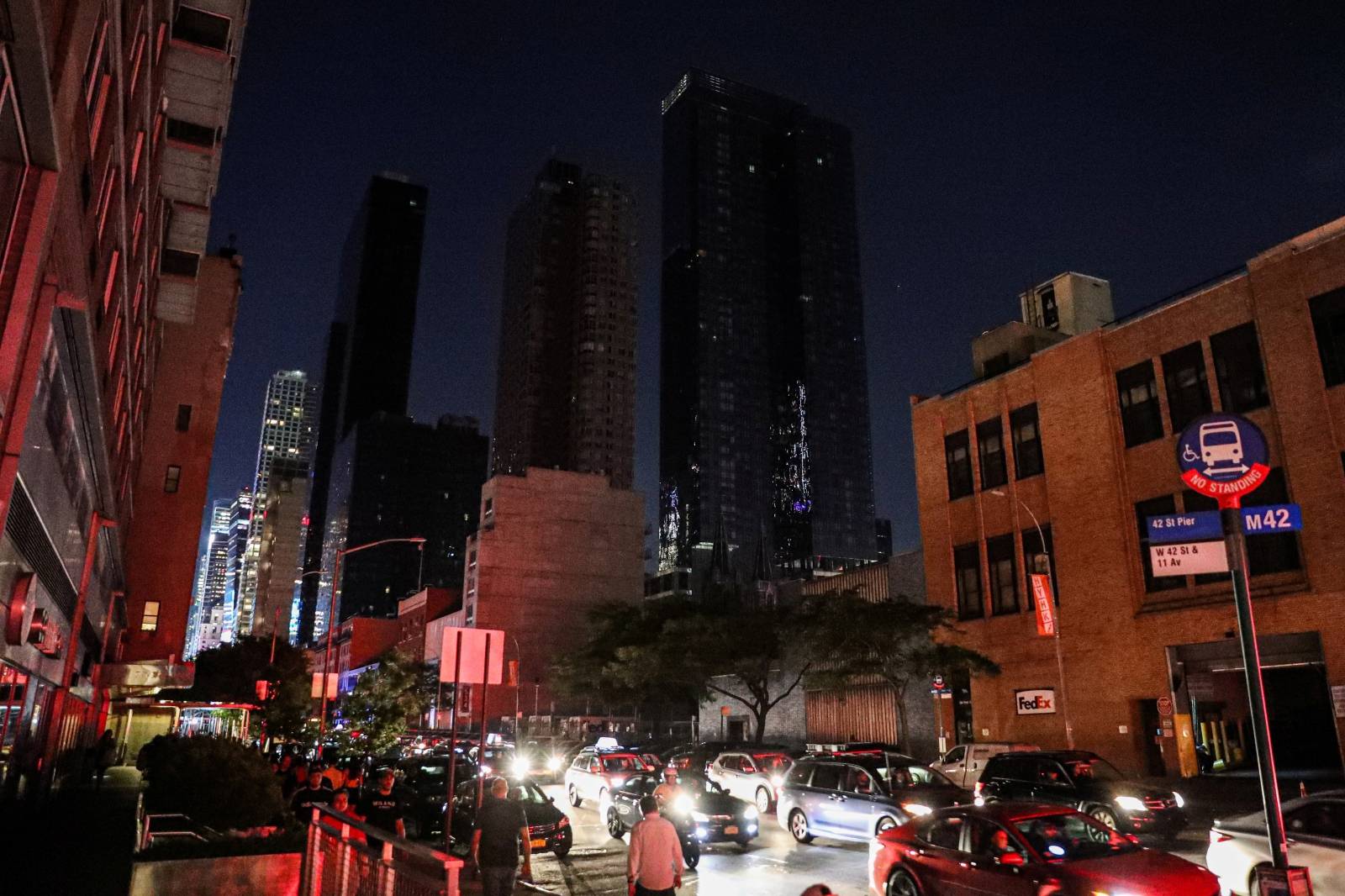 A residential building light out near Times Square area, as a blackout affects buildings and traffic during widespread power outages in the Manhattan borough of New York