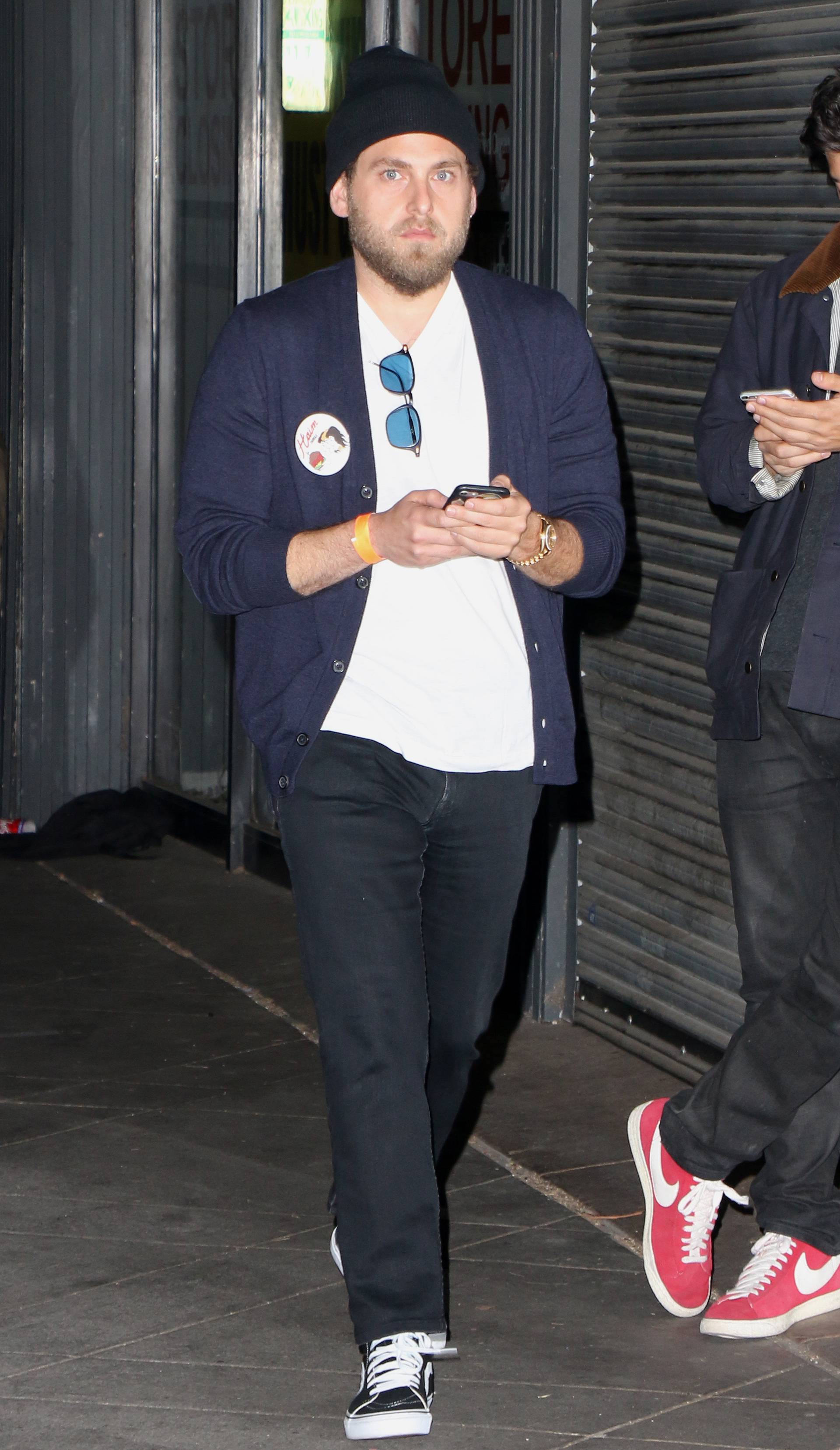 Jonah Hill walks outside of Canter's in Los Angeles on his way to a party for Music Band Haim