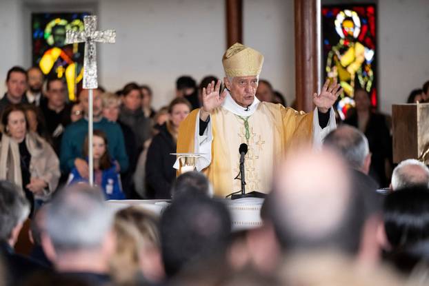 Sunday Mass at the chapel of Saint-Christophe dedicated to the victims of the fire at the 'Le Constellation' bar and lounge
