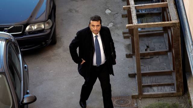 Captain of the Costa Concordia cruise liner Francesco Schettino arrives at court to attend his trial in Grosseto