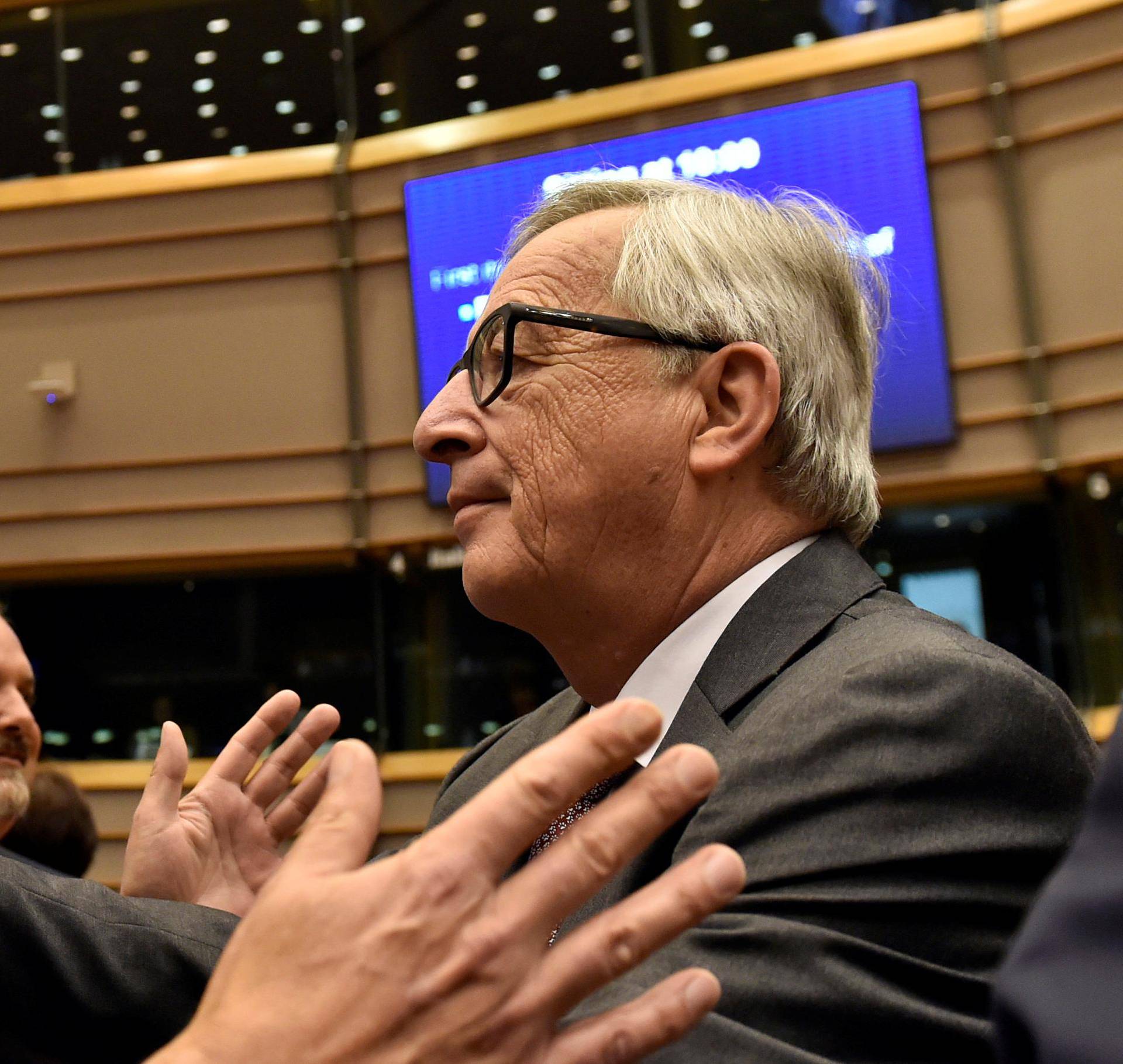 EC President Juncker welcomes Farage, the leader of the UKIP, prior to a plenary session at the European Parliament on the outcome of the "Brexit" in Brussels