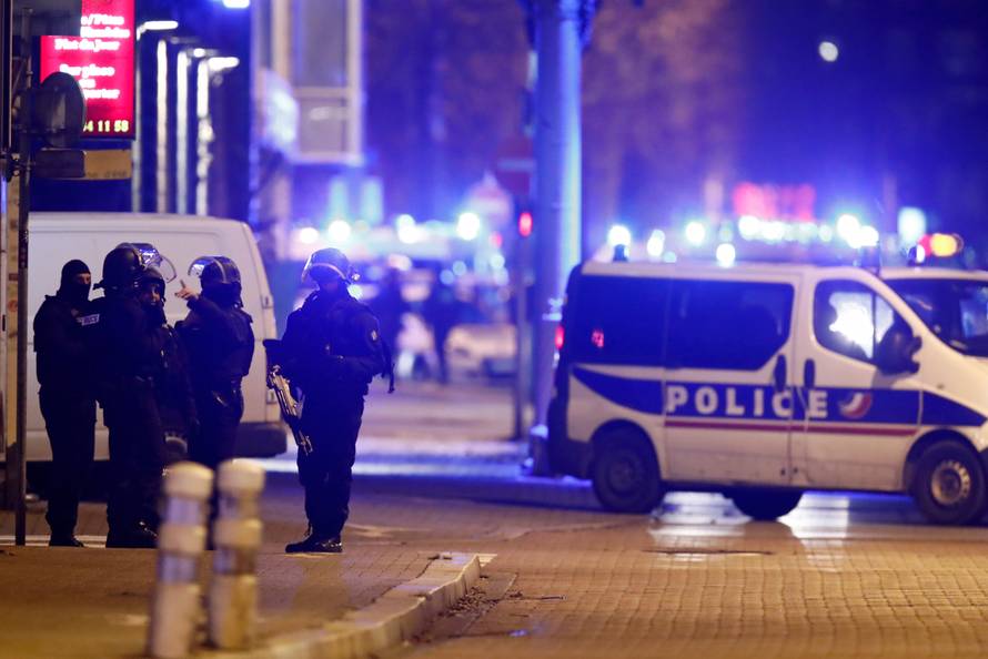 French special police forces secure an area during a police operation in the Meinau district after the deadly shooting in Strasbourg