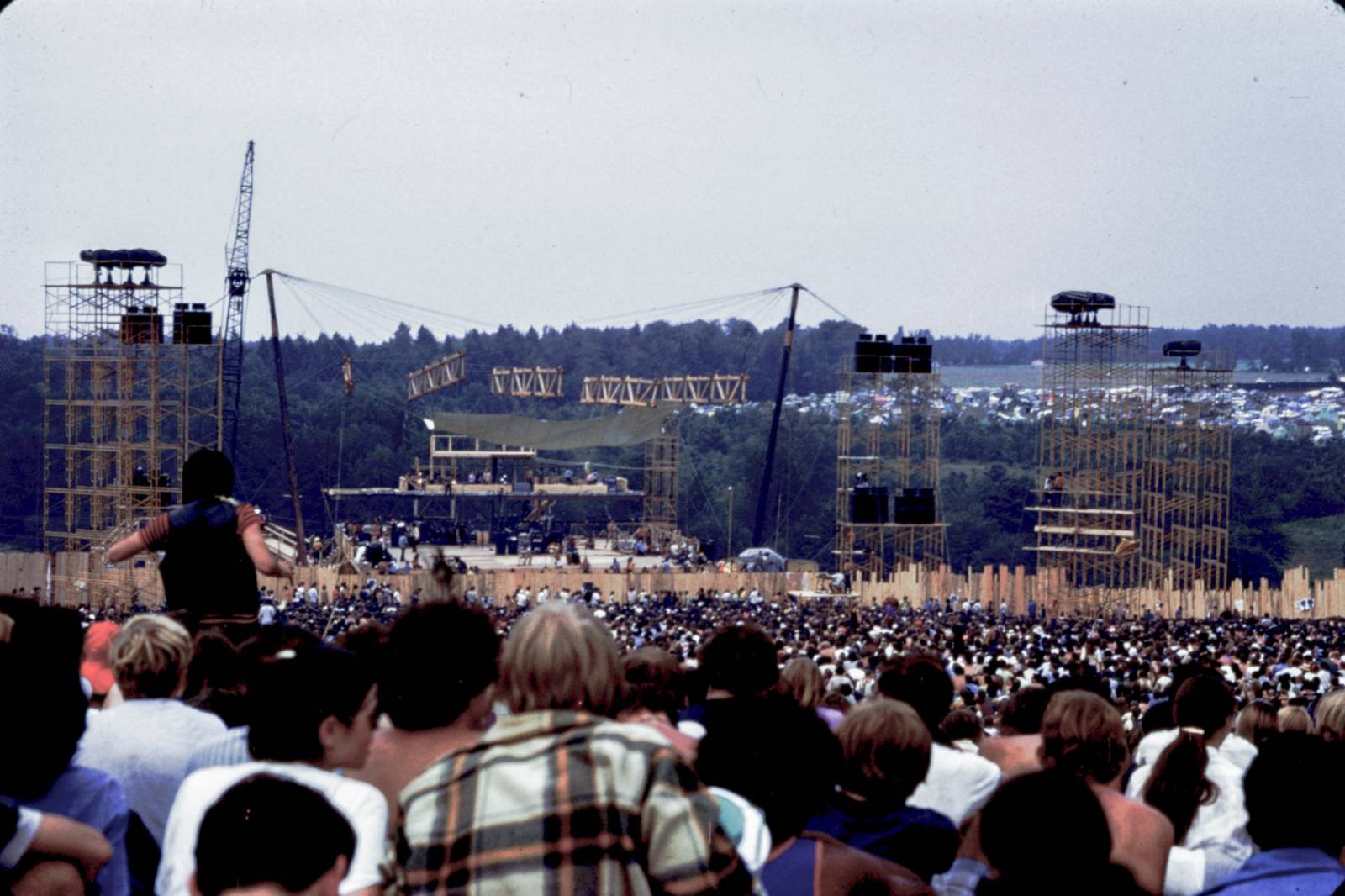 Attendees watch performing artists at the Woodstock Music Festival in August 1969, Bethel, New York, U.S. in this handout image