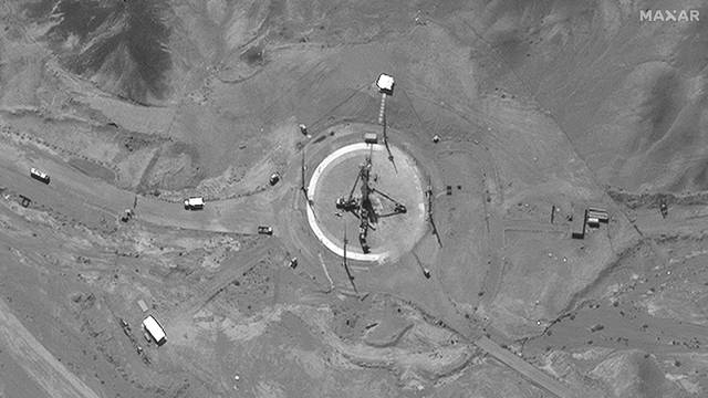 A satellite image shows a rocket erected at a launch pad of Imam Khomeini Space Center southeast of Semnan