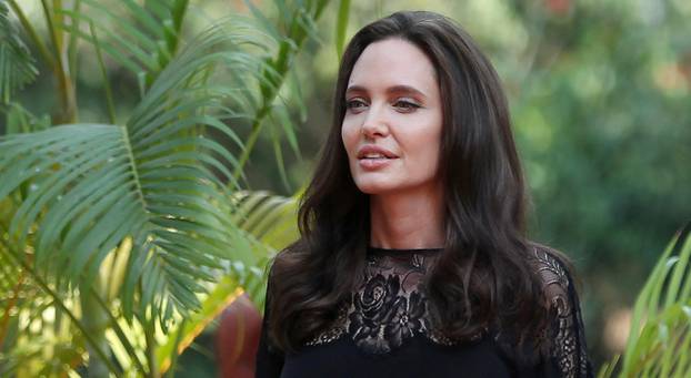 Actress Angelina Jolie arrives for a news conference at a hotel in Siem Reap