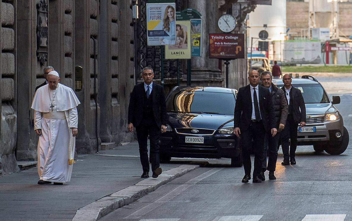 Pope Francis walks in a deserted Rome to pray at two shrines for the end of the coronavirus pandemic, in Rome