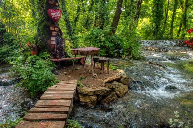Turquoise color of water in the summer on the river Janj
