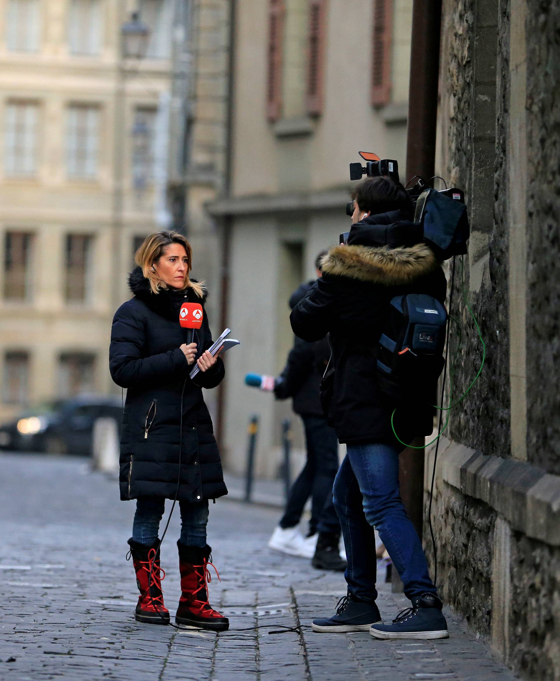 Journalists stand outside residence of Spain's Princess Cristina, sister of King Felipe VI in Geneva
