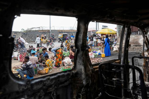Residents survey damage from fighting between M23 rebels and Congolese forces in Goma