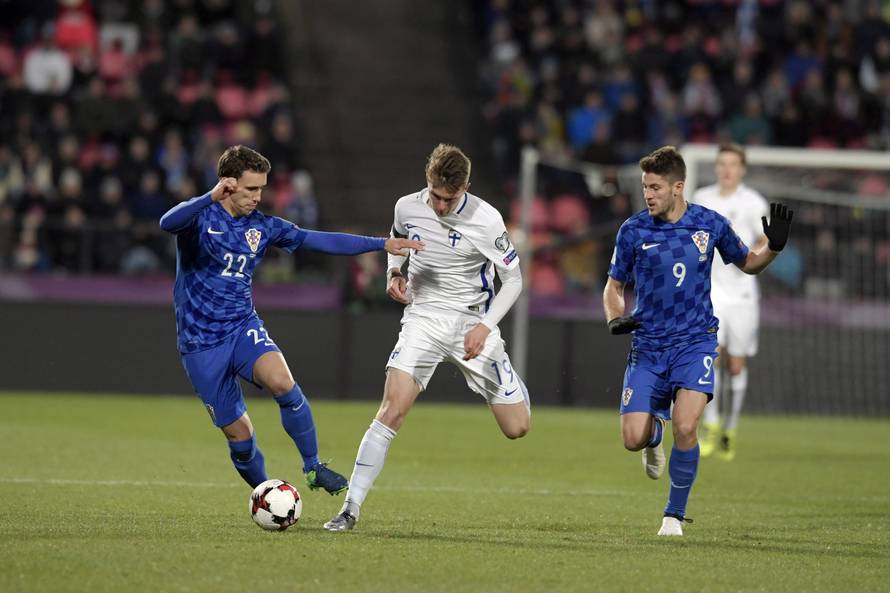 Finland's Janne Saksela, Croatia's Josip Pivaric and Andrej Kramaric in action during the FIFA World Cup 2018 football qualification match between Finland and Croatia in Tampere
