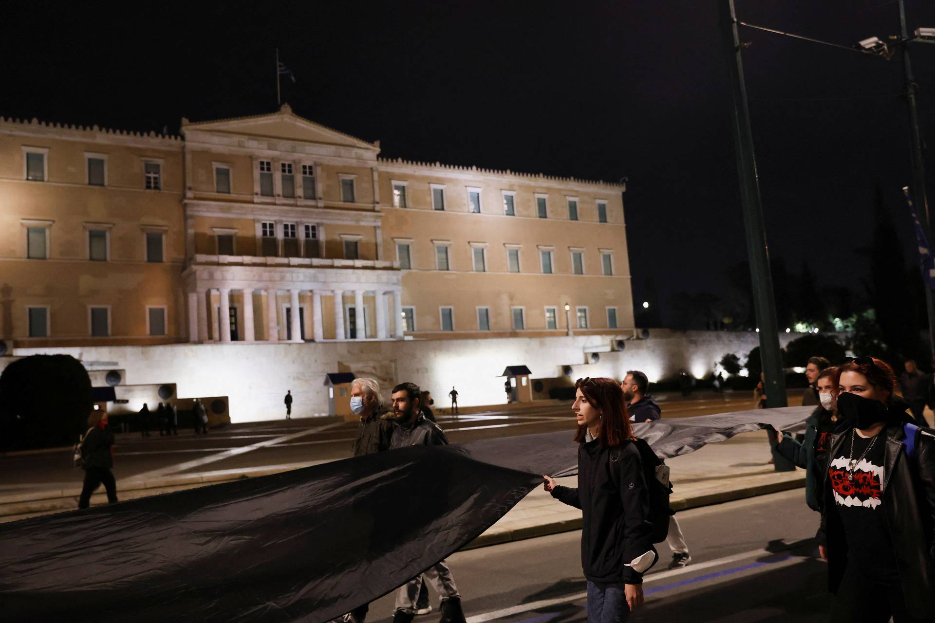 Protesters take part in a demonstration after a train crash near the city of Larissa, in Athens