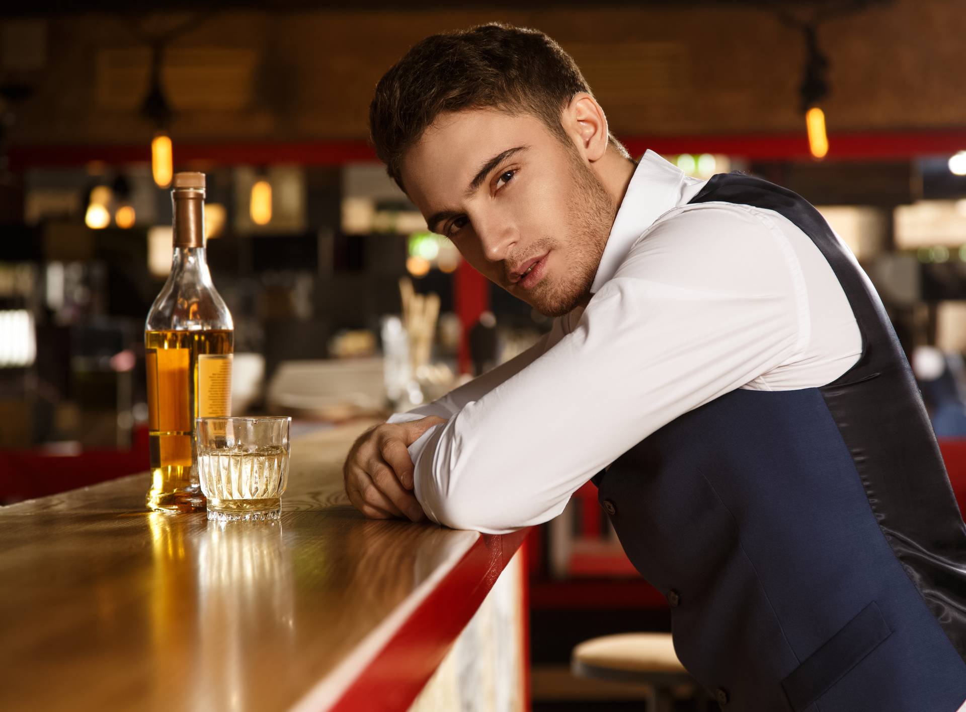 Shots of a handsome man relaxing at the bar 