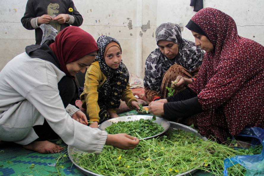 FILE PHOTO: Displaced Palestinians shelter at an UNRWA school in Jabalia refugee camp in the northern Gaza Strip