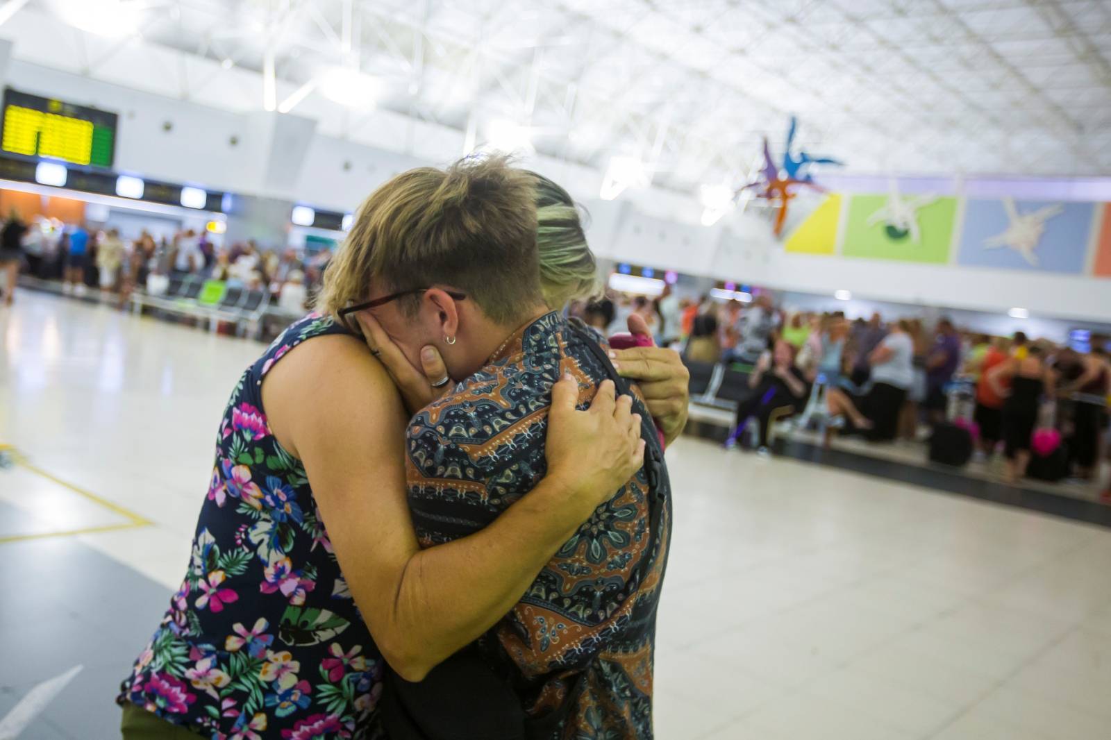 Thomas Cook passengers are seen at Las Palmas Airport after the world's oldest travel firm collapsed