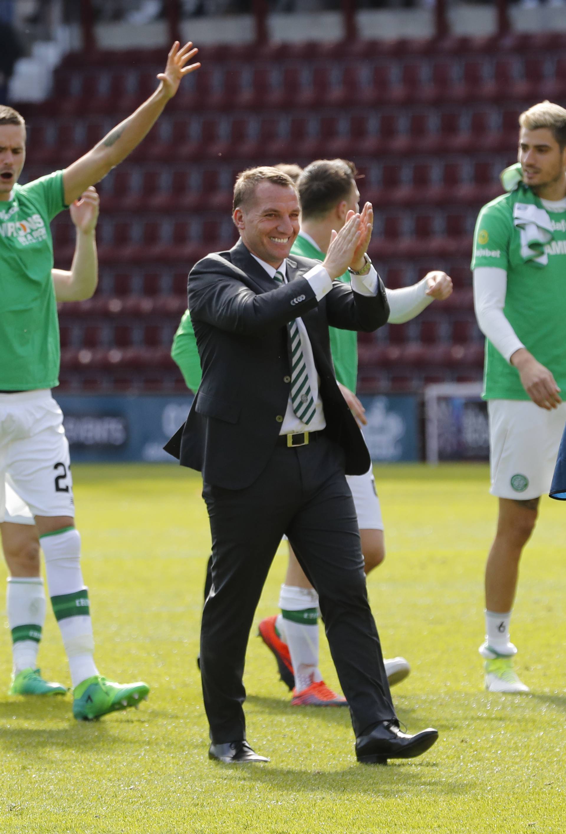 Celtic manager Brendan Rodgers and their players celebrate winning the Scottish Premiership