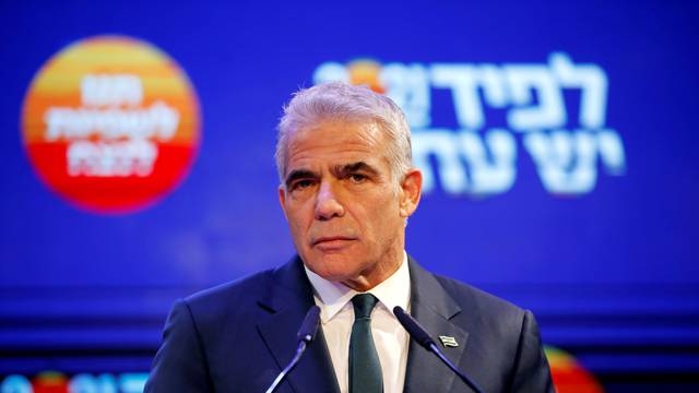 FILE PHOTO: Yesh Atid party leader Yair Lapid delivers a speech following the announcement of exit polls in Israel's general election at his party headquarters in Tel Aviv