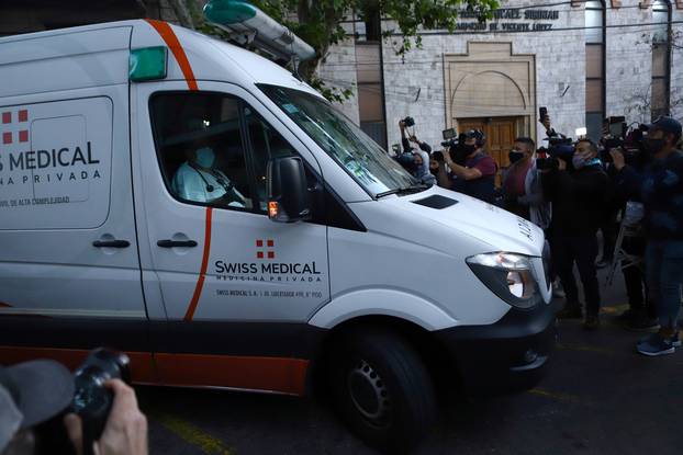 An ambulance carrying Argentine soccer great Diego Maradona arrives at the clinic where he will be undergoing surgery for a subdural haematoma, according to his personal physician, in Olivos