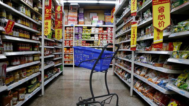 FILE PHOTO: Empty shopping cart is seen at a branch store of Wal-Mart in Beijing, China