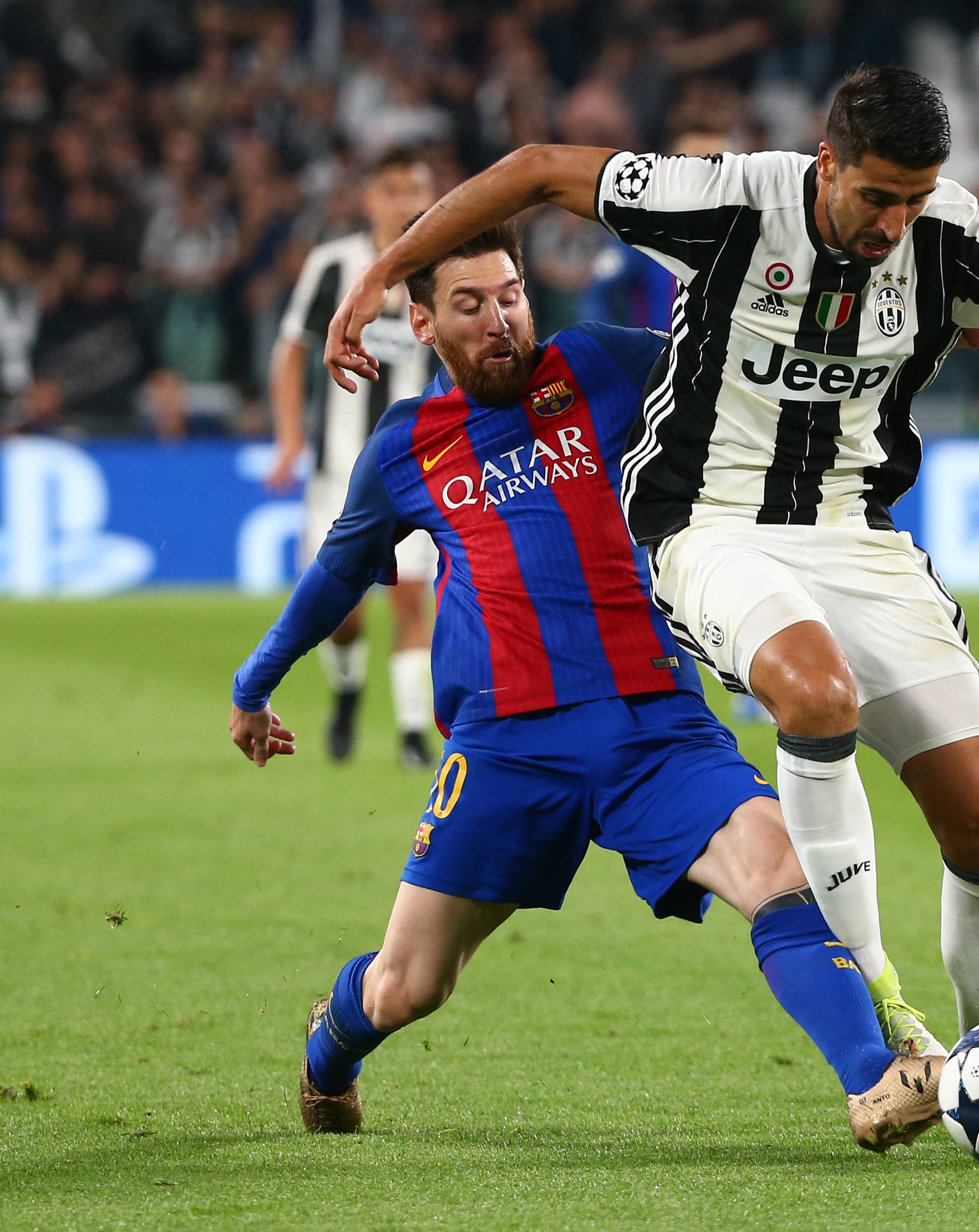 Juventus' Sami Khedira in action with Barcelona's Lionel Messi