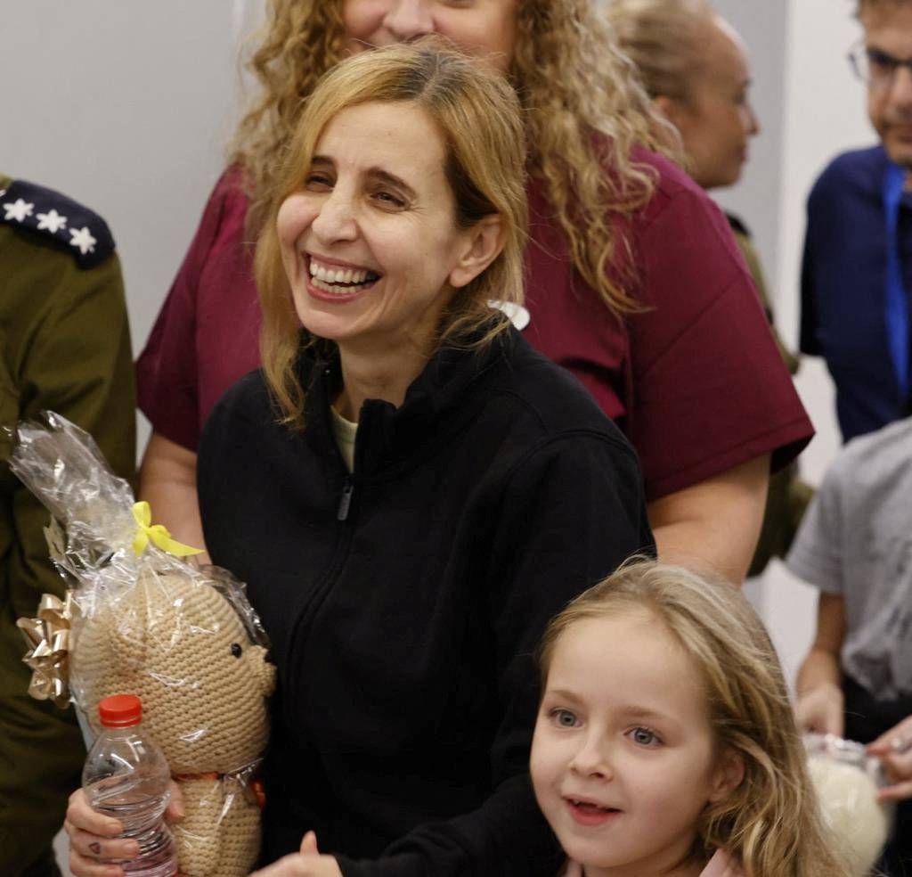 Six year-old Amelia Aloni and her mother Daniel react as they meet their family members after they returned to Israel last night to the designated complex at the Schneider Children's Medical Center