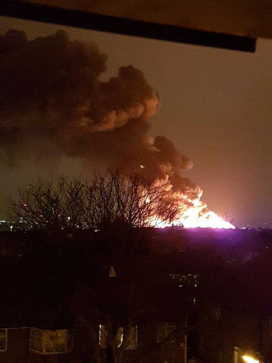 Smoke rises from a fire at a paint factory in Brent Cross, London