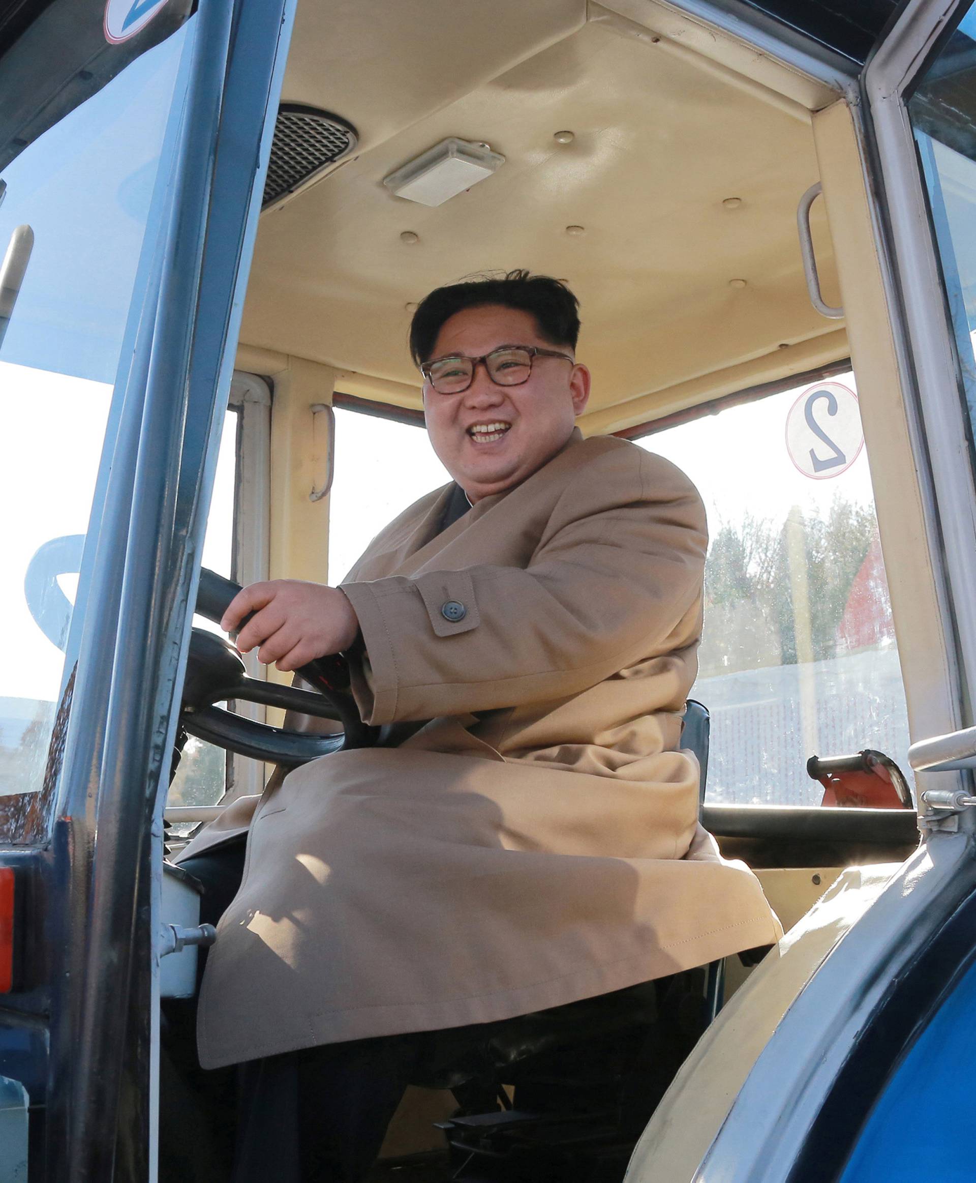 North Korean leader Kim Jong Un gives field guidance to the Kumsong Tractor Factory in this undated picture provided by KCNA