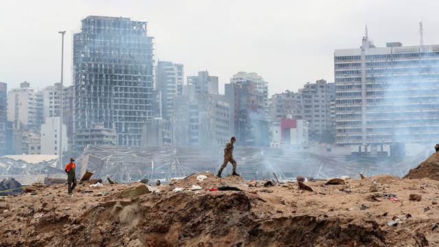 A soldier walks at the devastated site of the explosion at the port of Beirut