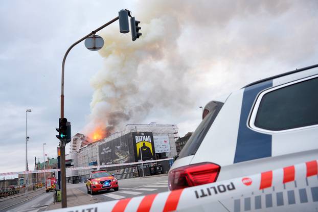 Smoke billows as fire burns at the Old Stock Exchange, Boersen, in Copenhagen