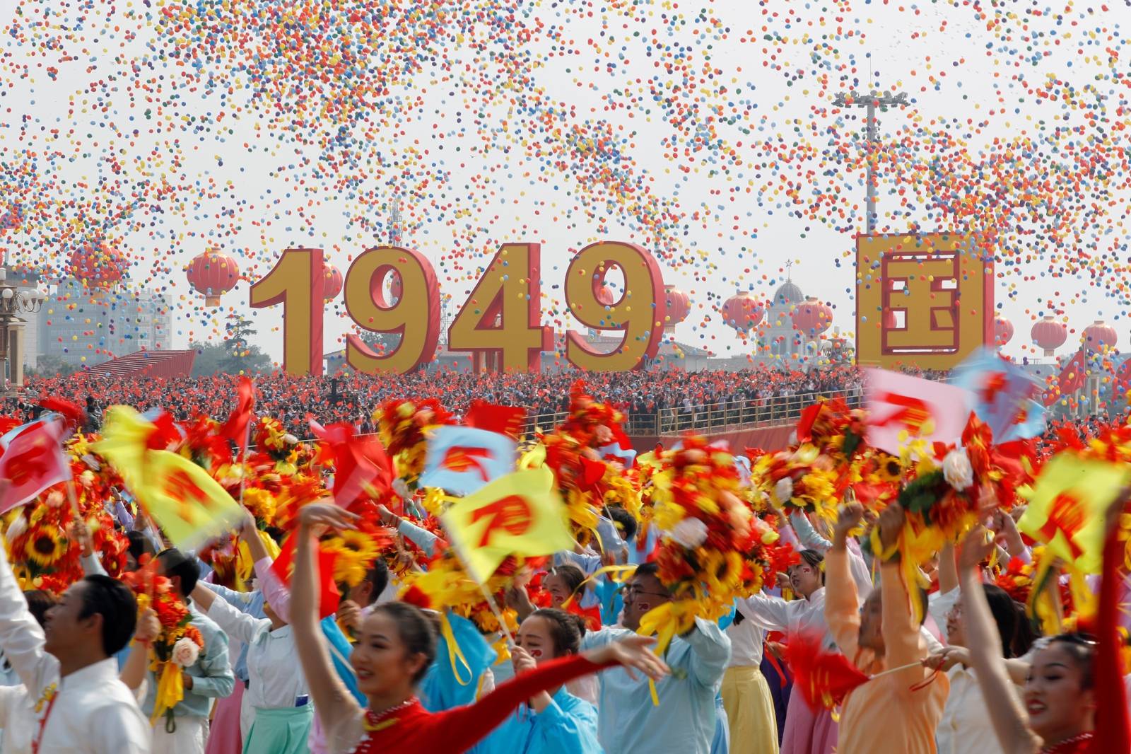 Balloons are seen above performers at the end of the parade marking the 70th founding anniversary of People's Republic of China