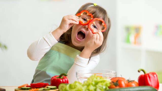 Kid,Girl,Having,Fun,With,Food,Vegetables,At,Kitchen