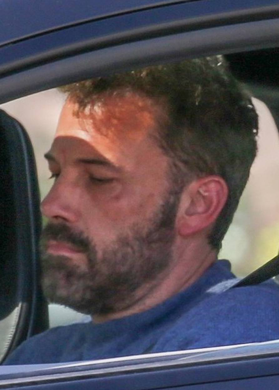 *EXCLUSIVE* Ben Affleck looks busy while driving as he picks up his son Samuel in Santa Monica