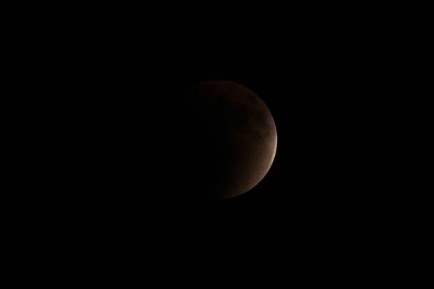 A "Blood Moon" rises in the sky during a total lunar eclipse in Dubai