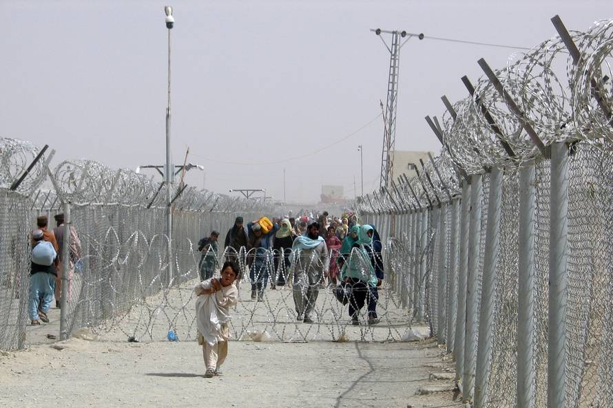 FILE PHOTO: People cross Friendship Gate at Pakistan-Afghanistan border town of Chaman