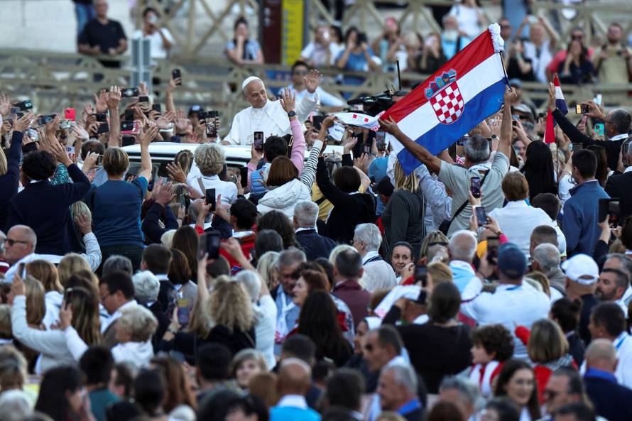 Pope Leo XIV greets the faithful ahead of a Holy Mass presided over by Metropolitan Archbishop of Zagreb Drazen Kutlesa, at the Vatican