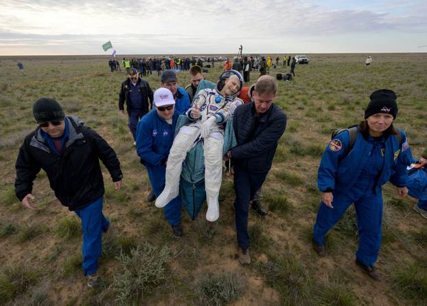 The Soyuz MS-26 space capsule carrying the International Space Station (ISS) crew lands in a remote area of Kazakhstan