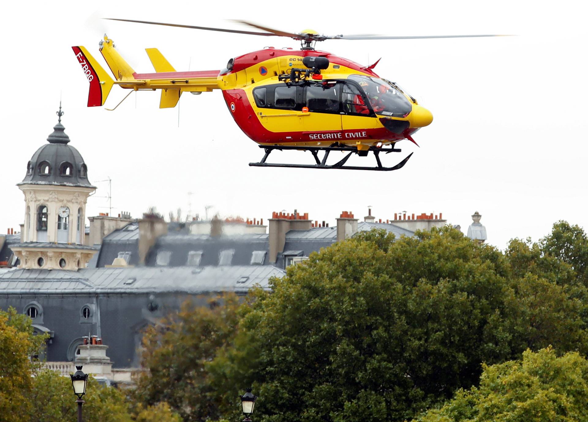 A rescue helicopter is seen after an attack on the police headquarters in Paris