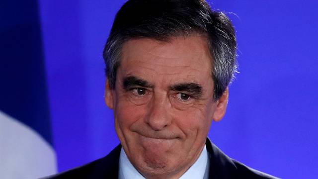 FILE PHOTO: Francois Fillon, member of the Republicans political party and 2017 French presidential election candidate of the French centre-right, reacts as he delivers a speech at his campaign headquarters in Paris