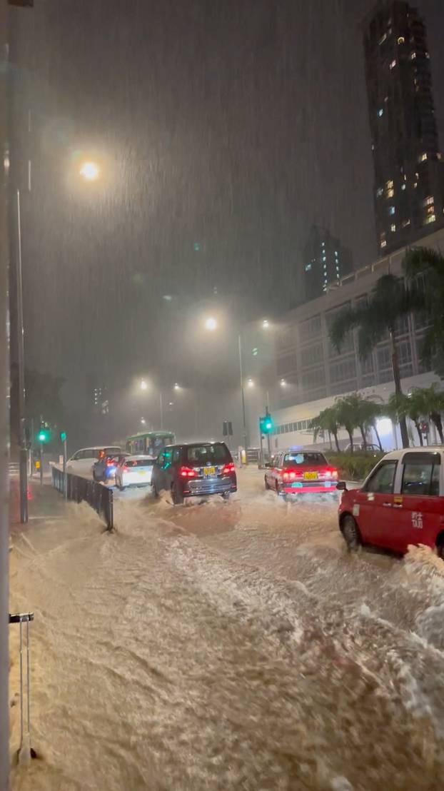A view of a flooded road after heavy rains, in Hong Kong