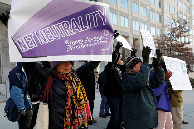Net neutrality advocates rally in front of the Federal Communications Commission in Washington