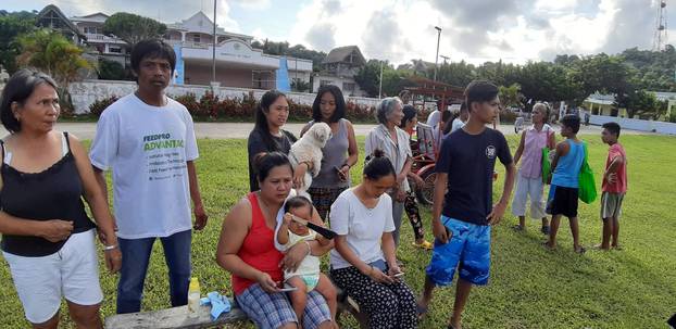 People gather on a field after an earthquake struck the Batanes Province, in northern Philippines