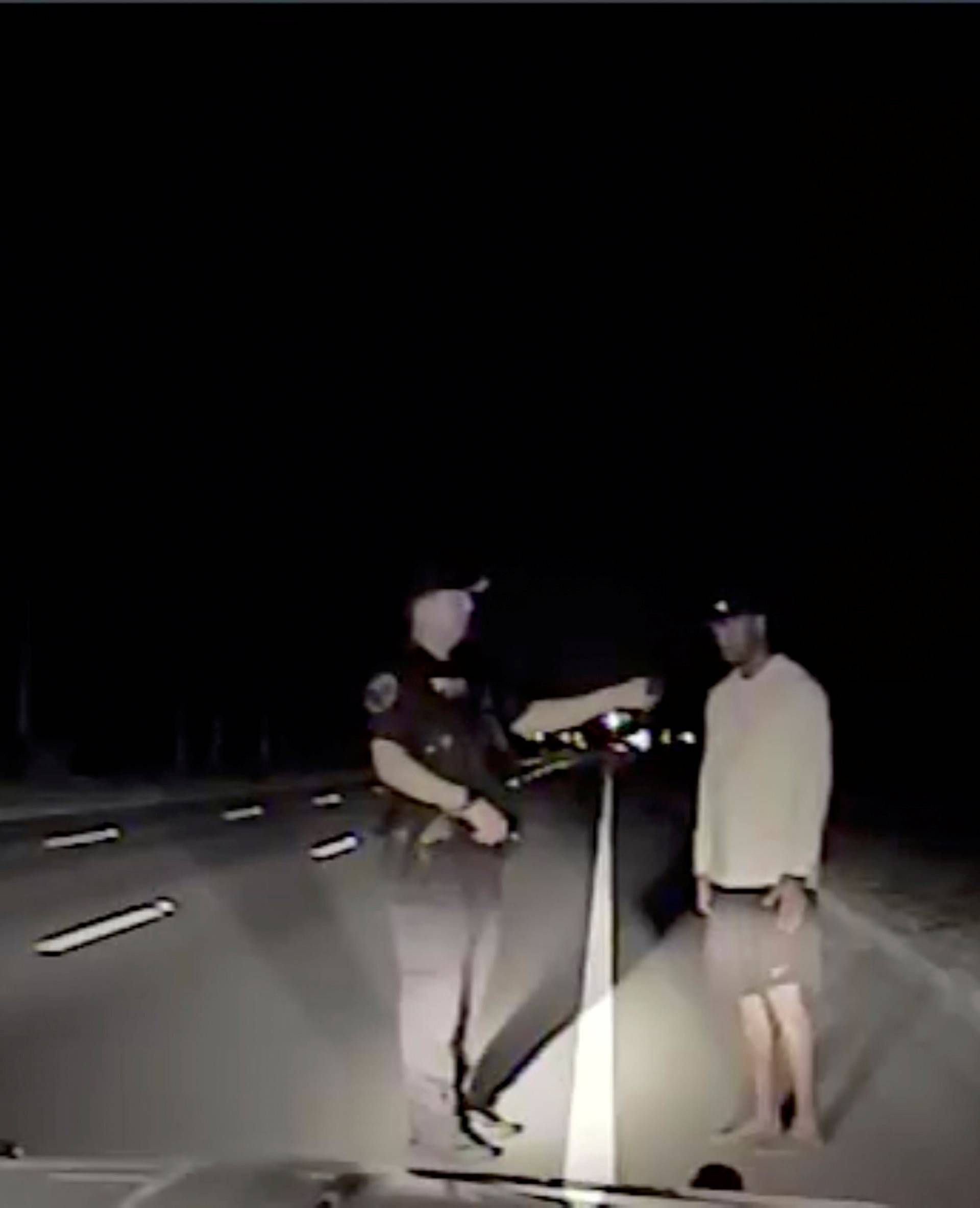 Tiger Woods is seen performing field sobriety tests following orders from a police officer in Jupiter