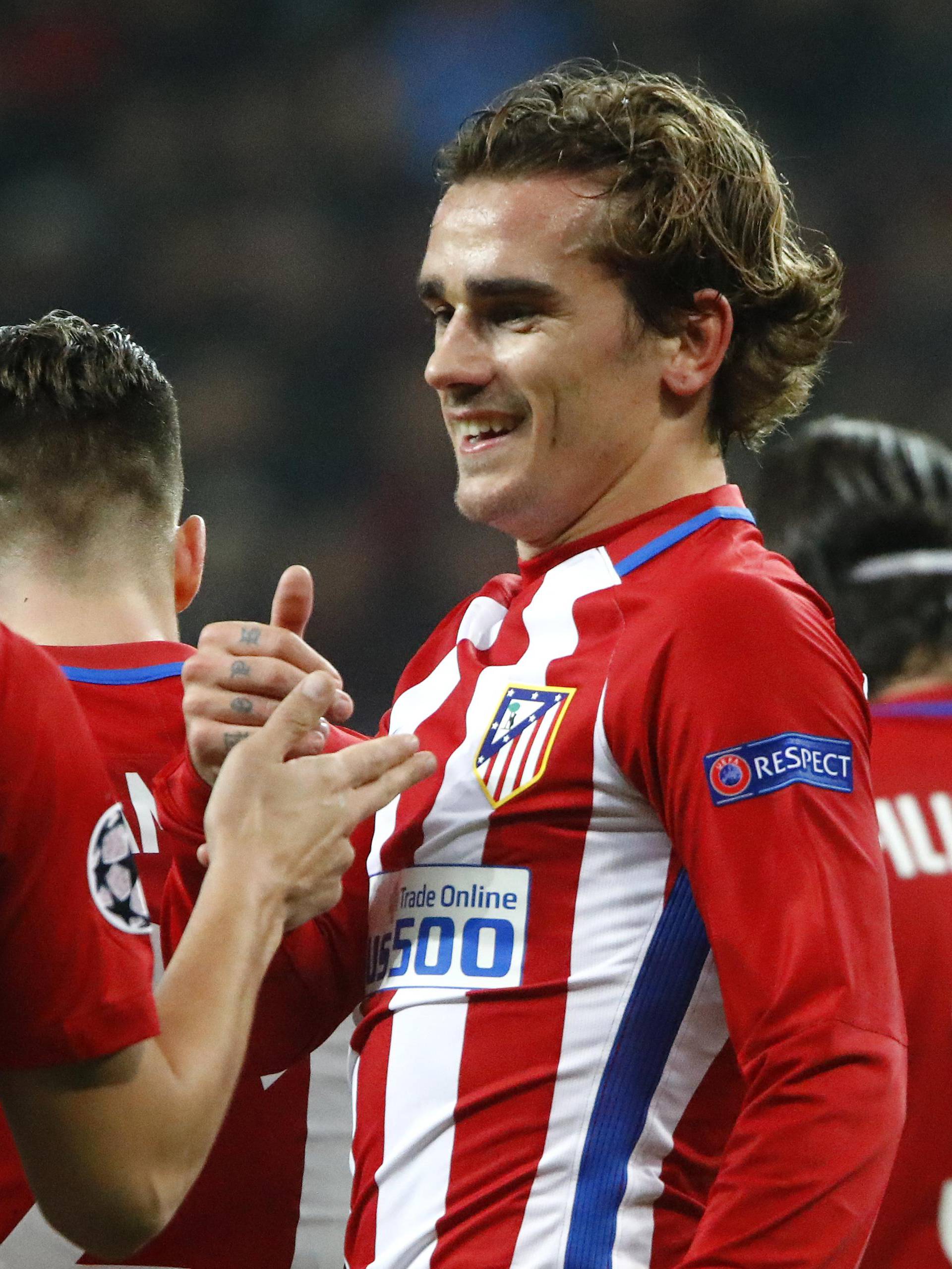 Atletico Madrid's Antoine Griezmann celebrates scoring their second goal with Koke and teammates