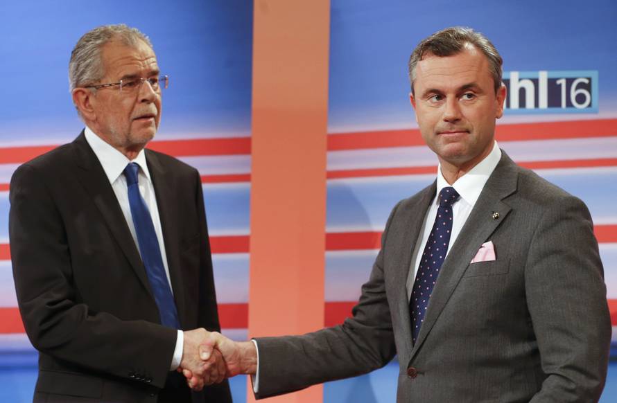 Presidential candidates Hofer and Van der Bellen shake hands before TV debate after Austrian presidential election in Vienna